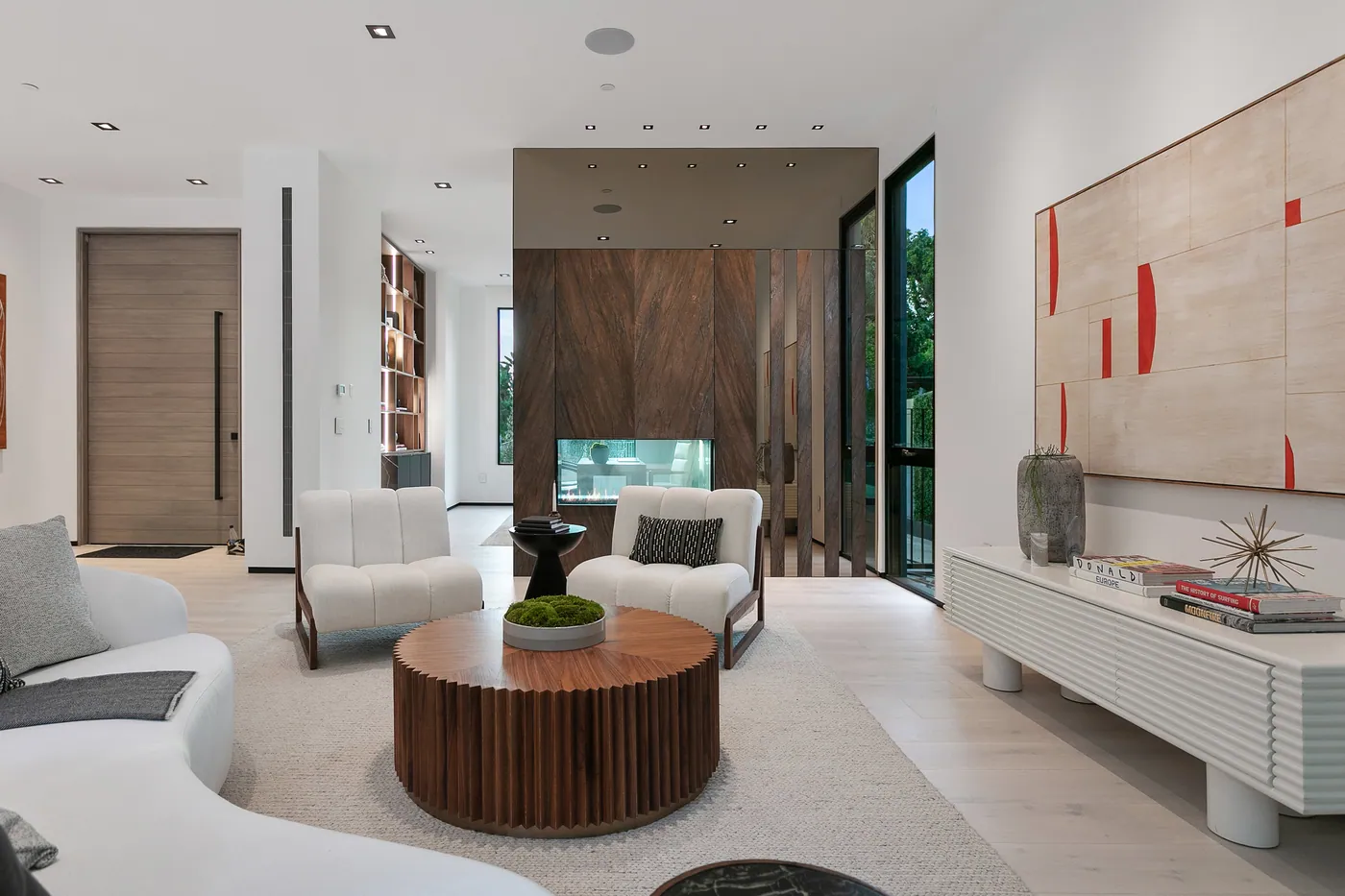 Sitting room with a round walnut table