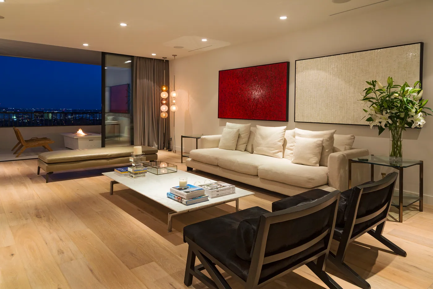 Living room at dusk with city lights