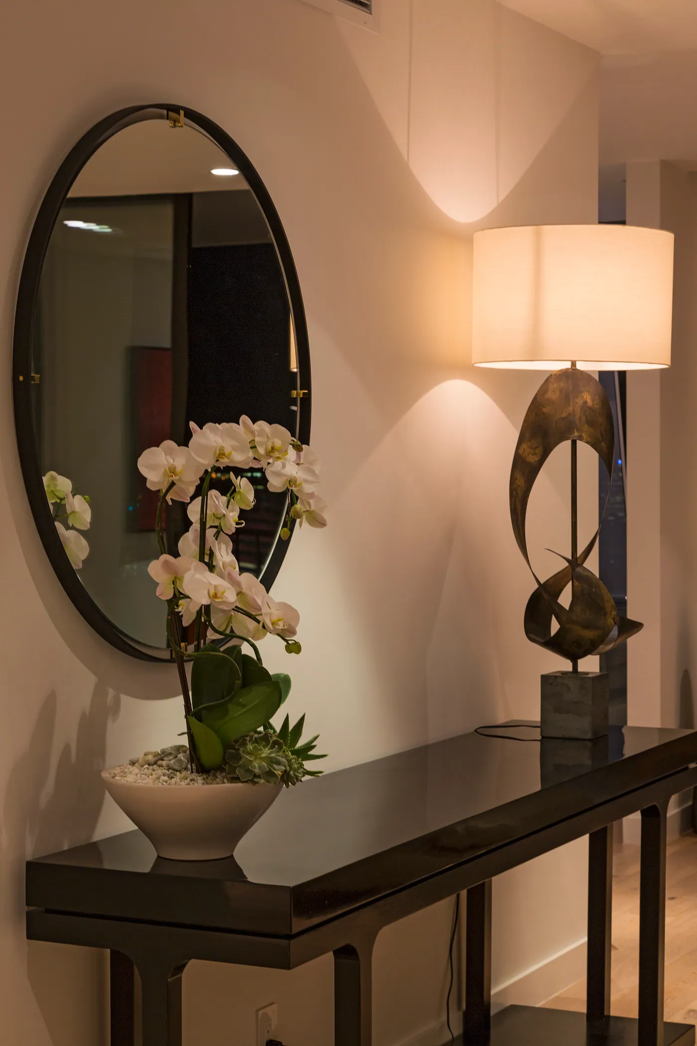 Entry console with mirror and sculptural lamp