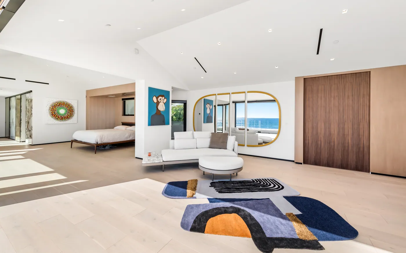 Primary suite with bed and lounge