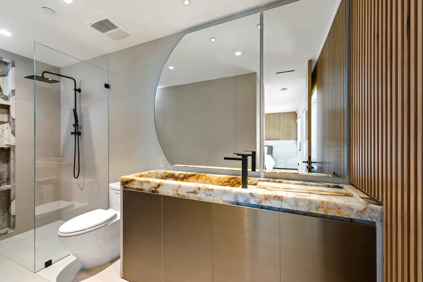Bath with a sculpted stone vanity