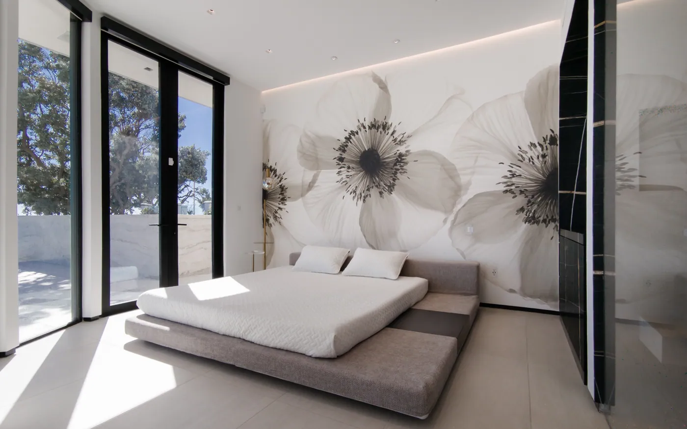 Guest bedroom with a floral mural