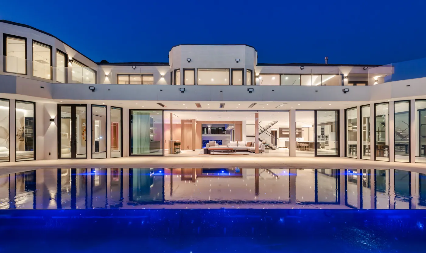 Courtyard pool and house at blue hour