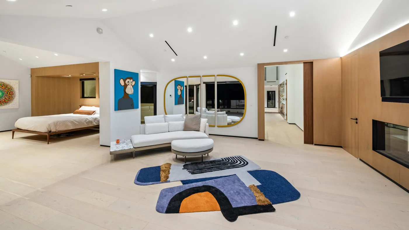 Primary suite with fireplace wall