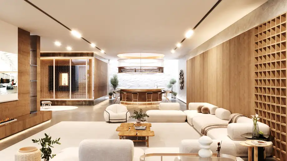 A living room opening to a pool terrace through full-height sliding glazing