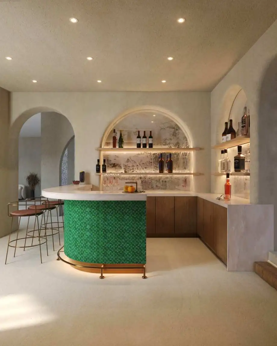 A bar with backlit shelving and a stone counter