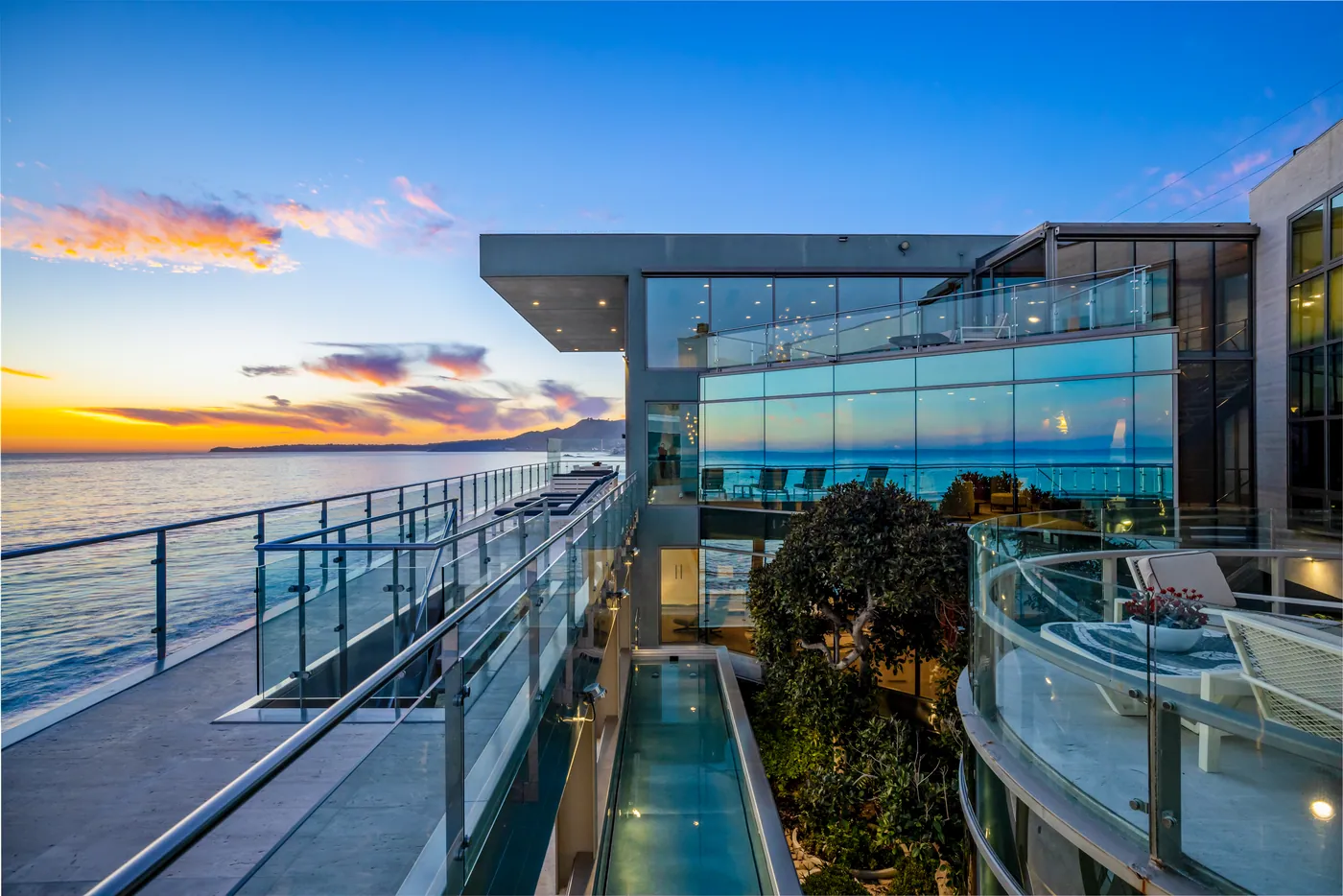 Terraces and glass facade at sunset