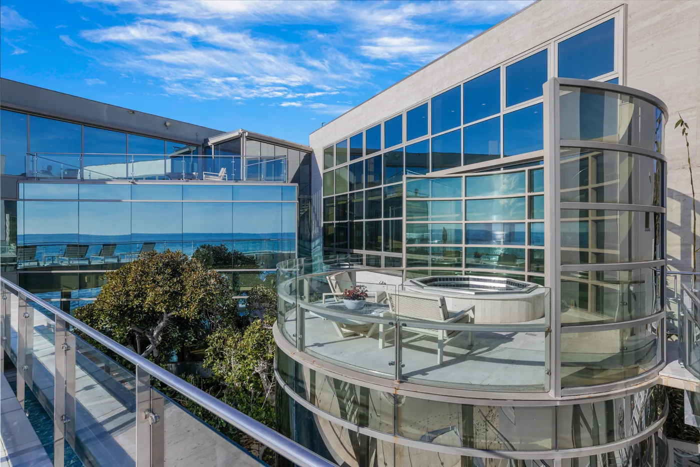 Curved glass balconies and lap pool