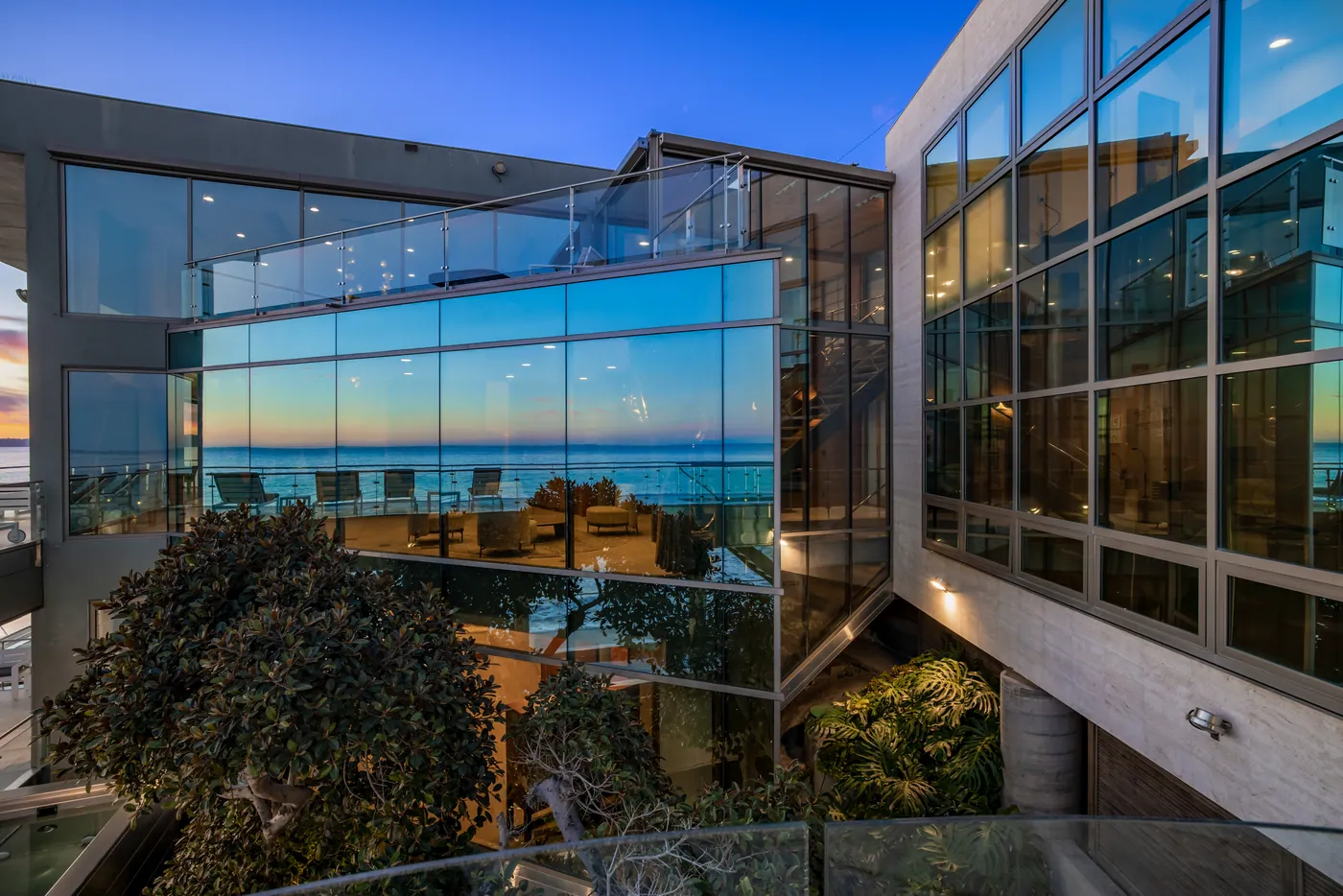 Glass facade reflecting the sunset