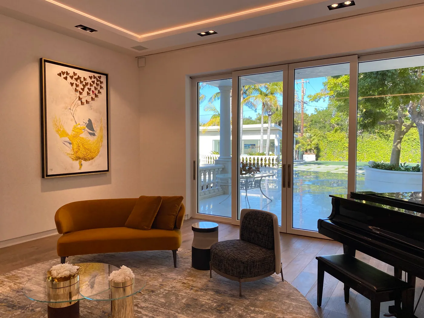 Sitting room with piano and garden doors