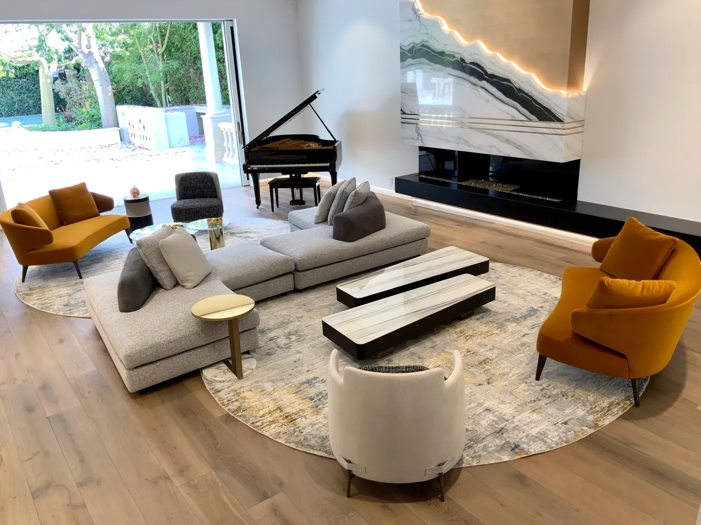 Living room with piano and stone fireplace