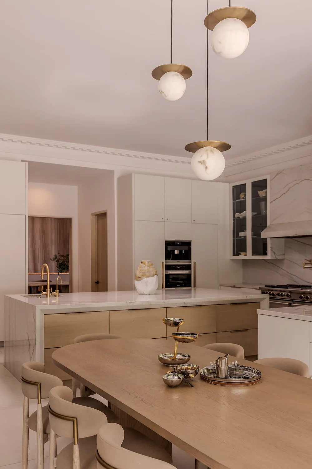 Kitchen and breakfast table under globe pendants