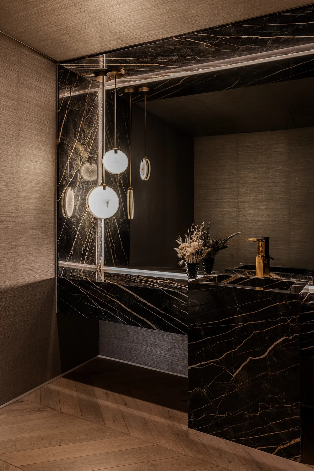 Guest bathroom in dark stone with a floating vanity
