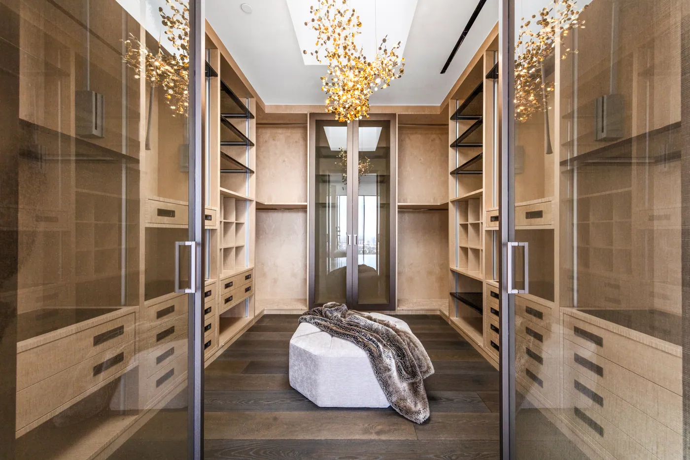 Dressing room in warm wood with glass doors