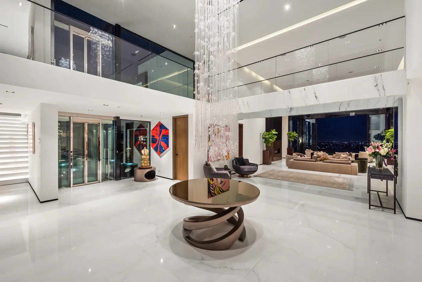 Double-height foyer with a crystal chandelier